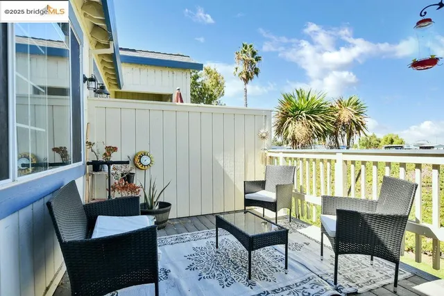 a living room with furniture potted plant and a window