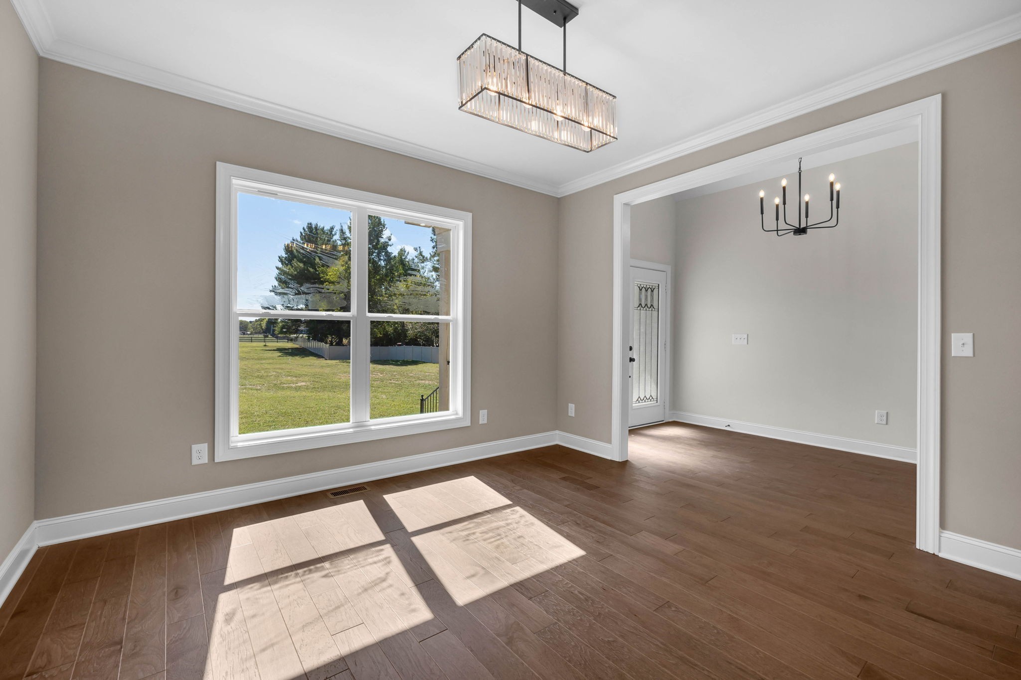 8708 Newtown Road Rockvale, TN 37153 - Photo 7 of 50 a view of an empty room with wooden floor and a window