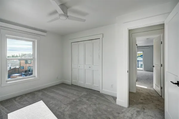 an empty room with closet area