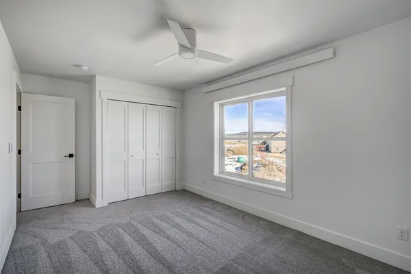 a bathroom with a double vanity sink toilet and shower