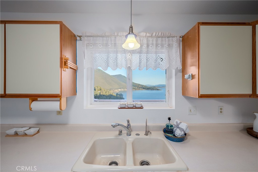 4777 Hawaina Way Kelseyville, CA 95451 - Photo 19 of 48 a bathroom with a sink and a mirror