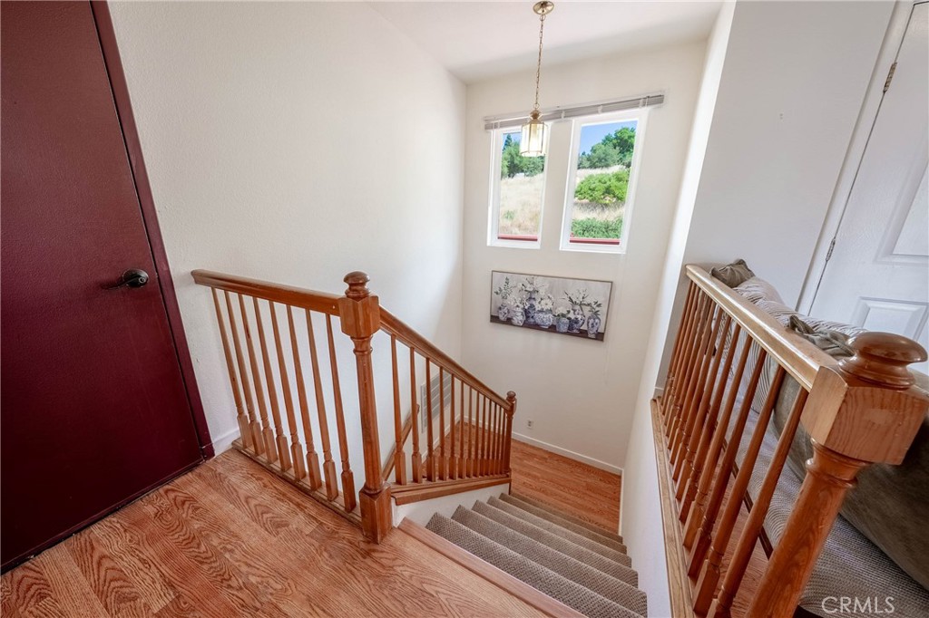 4777 Hawaina Way Kelseyville, CA 95451 - Photo 24 of 48 a view of a hallway with wooden floor and staircase