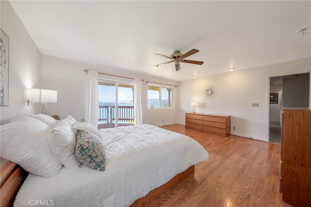 4777 Hawaina Way Kelseyville, CA 95451 - Photo 28 of 48 a spacious bedroom with a bed and a large window