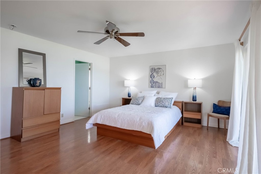 4777 Hawaina Way Kelseyville, CA 95451 - Photo 33 of 48 a bedroom with a bed and wooden floor