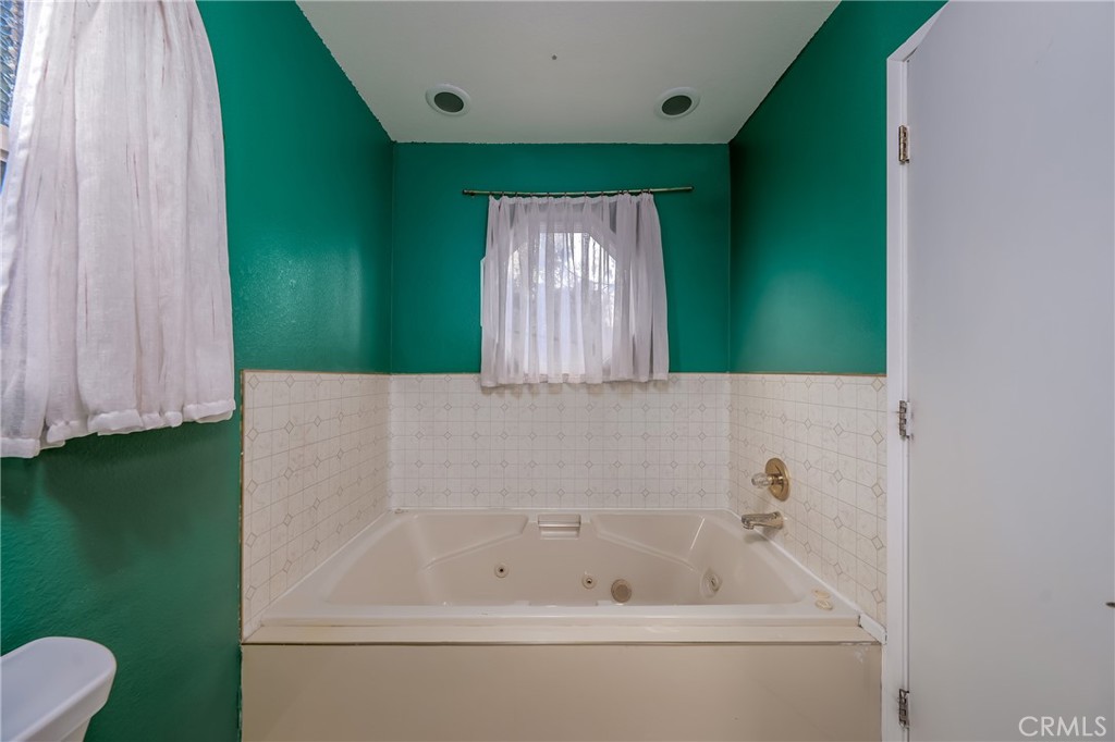 4777 Hawaina Way Kelseyville, CA 95451 - Photo 35 of 48 a bathroom with a bathtub and a shower