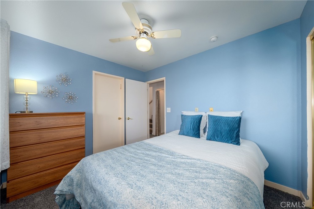 4777 Hawaina Way Kelseyville, CA 95451 - Photo 39 of 48 a bedroom with a bed and a chandelier