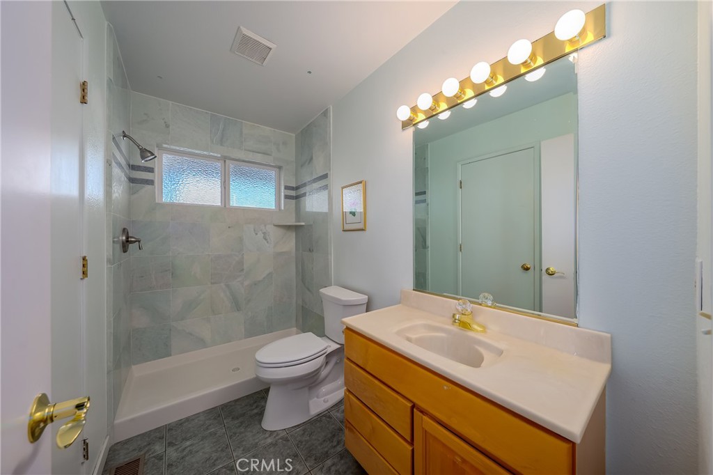 4777 Hawaina Way Kelseyville, CA 95451 - Photo 40 of 48 a bathroom with a sink a toilet and shower