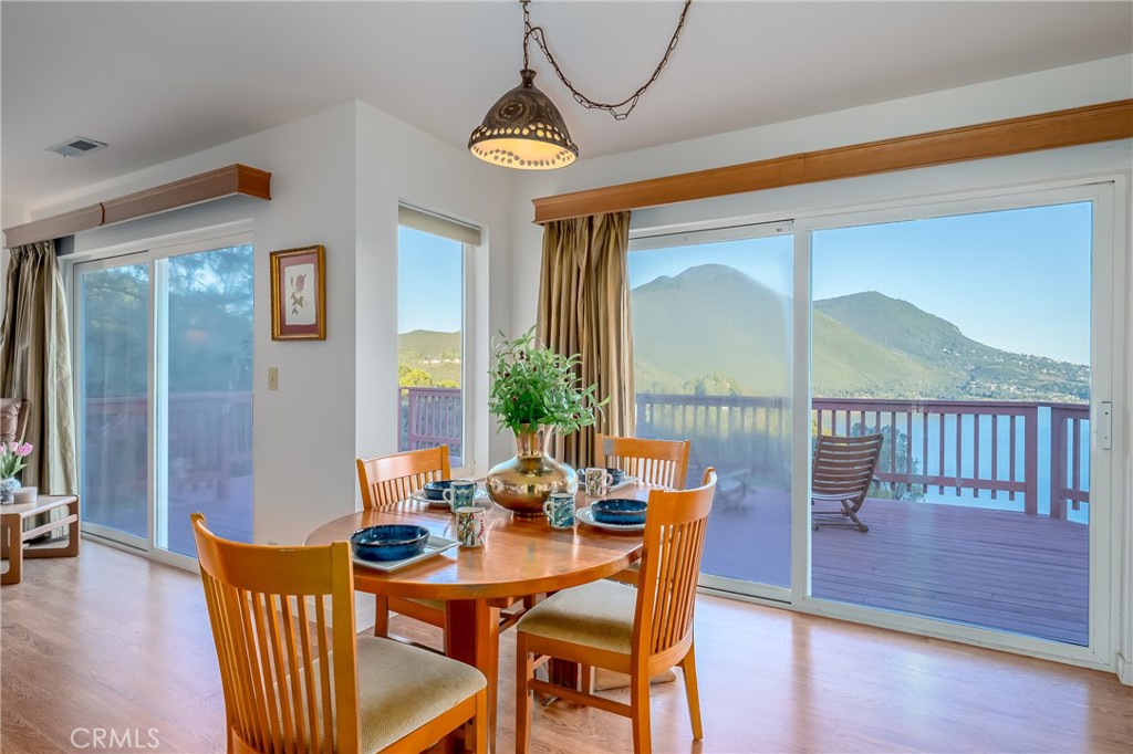 4777 Hawaina Way Kelseyville, CA 95451 - Photo 9 of 48 a dining room with furniture a chandelier and wooden floor