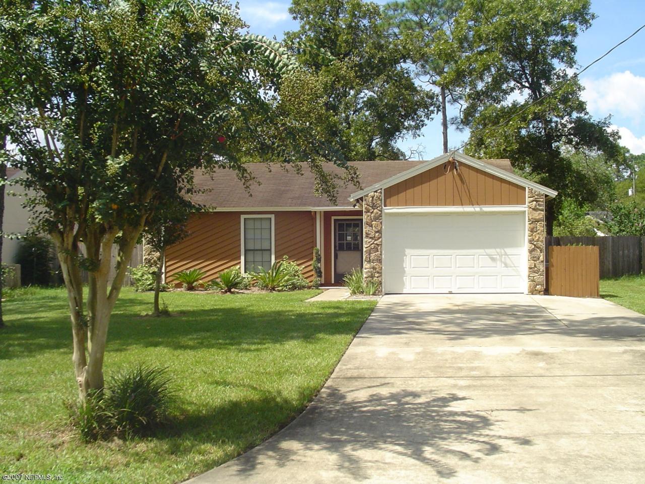 12766 Attrill Road Jacksonville, FL 32258 - Photo 1 of 12 a front view of a house with garden