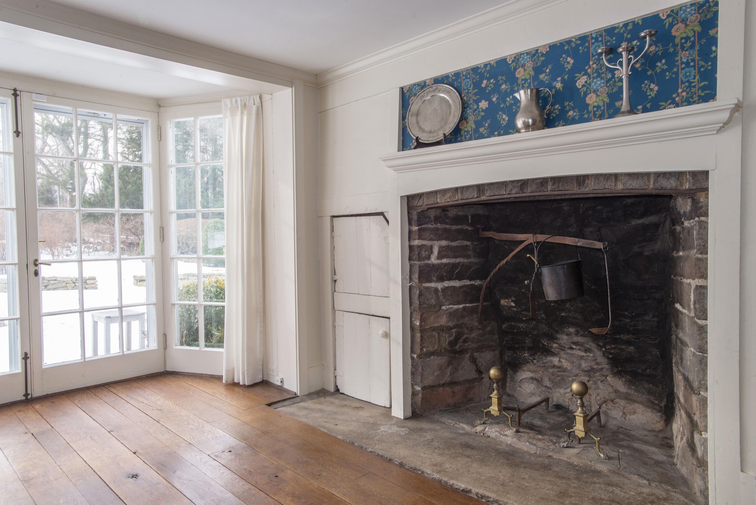 1161 Ponus Ridge Road New Canaan, CT 06840 - Photo 11 of 40 a view of a livingroom with a fireplace