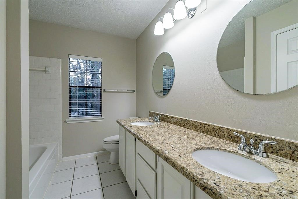 75 Breezy Point Place The Woodlands, TX 77381 - Photo 15 of 19 A secondary bath