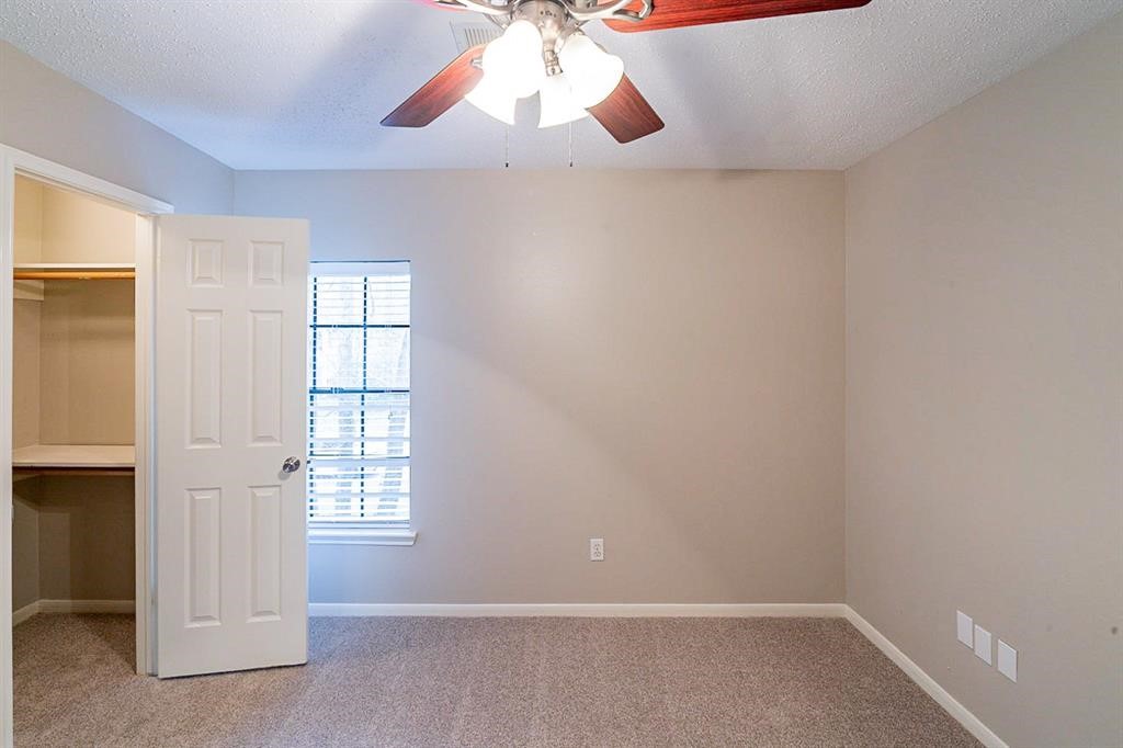 75 Breezy Point Place The Woodlands, TX 77381 - Photo 16 of 19 Secondary bedroom