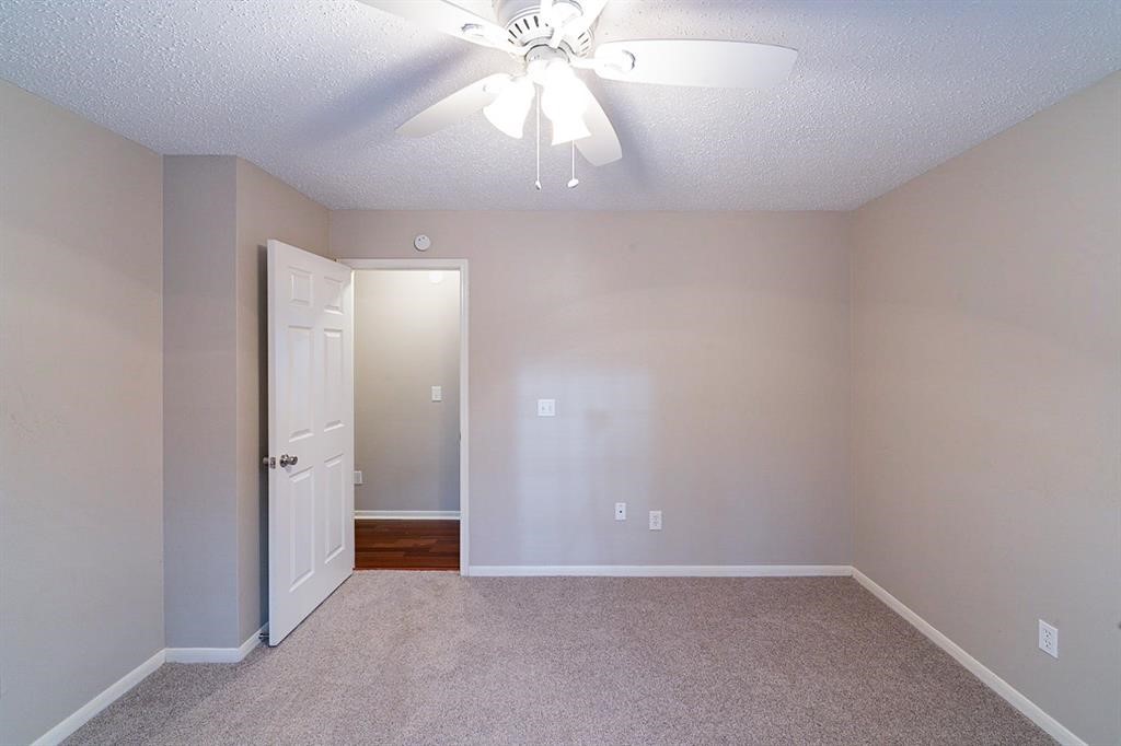 75 Breezy Point Place The Woodlands, TX 77381 - Photo 18 of 19 Still another secondary bedroom