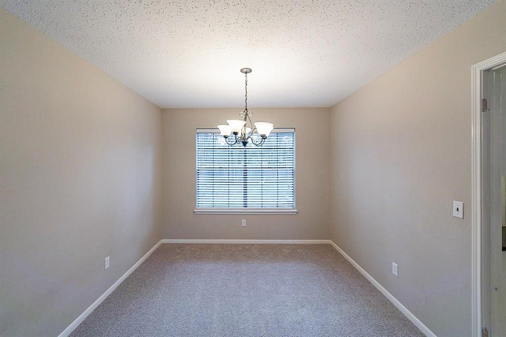 75 Breezy Point Place The Woodlands, TX 77381 - Photo 4 of 19 the formal dining adjacent to the kitchen....