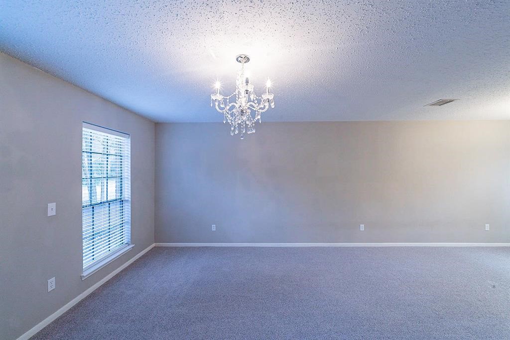 75 Breezy Point Place The Woodlands, TX 77381 - Photo 5 of 19 A view of living room from the entry..