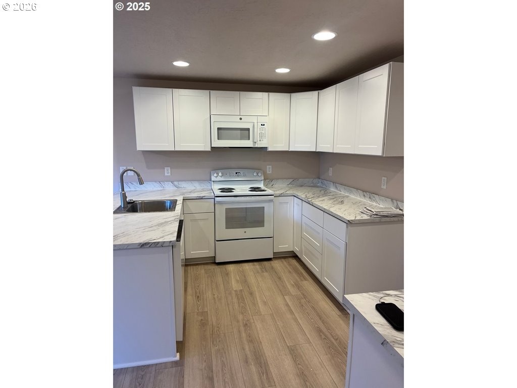 529 Helen Street Eugene, OR 97404 - Photo 2 of 9 a kitchen with a sink a stove and cabinets