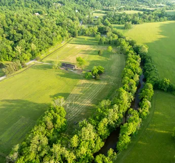 a view of a lake with a yard