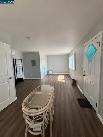 a room with furniture and a wooden floor