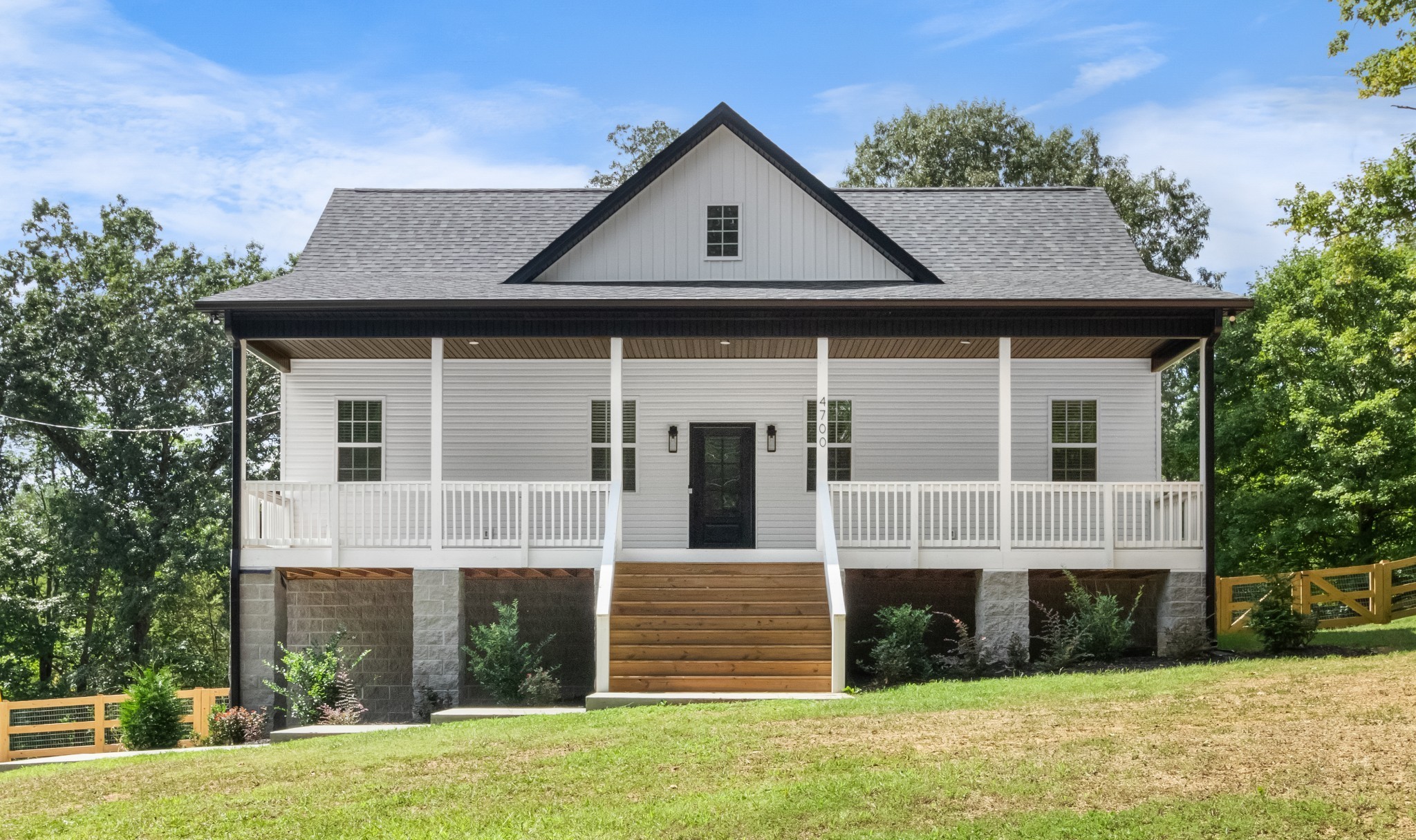 4700 Akin Road Cunningham, TN 37052 - Photo 1 of 36 a front view of a house with a yard
