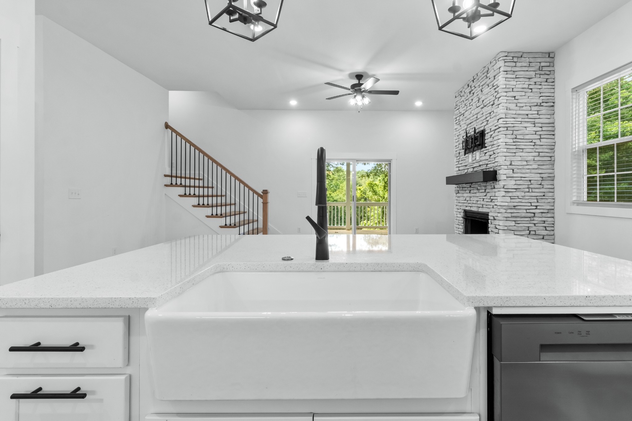 4700 Akin Road Cunningham, TN 37052 - Photo 16 of 36 a bathroom with a sink a chandelier and a flat screen tv
