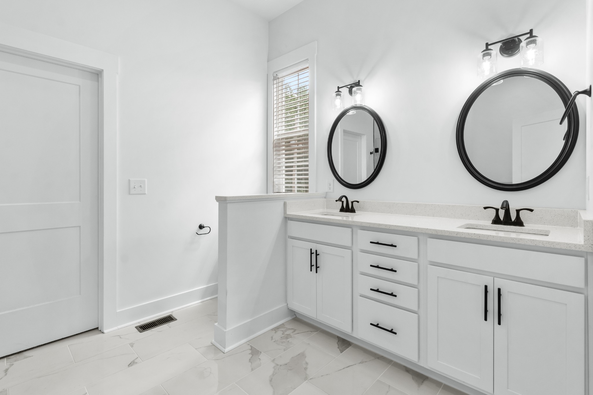 4700 Akin Road Cunningham, TN 37052 - Photo 18 of 36 a bathroom with a double vanity sink and a mirror