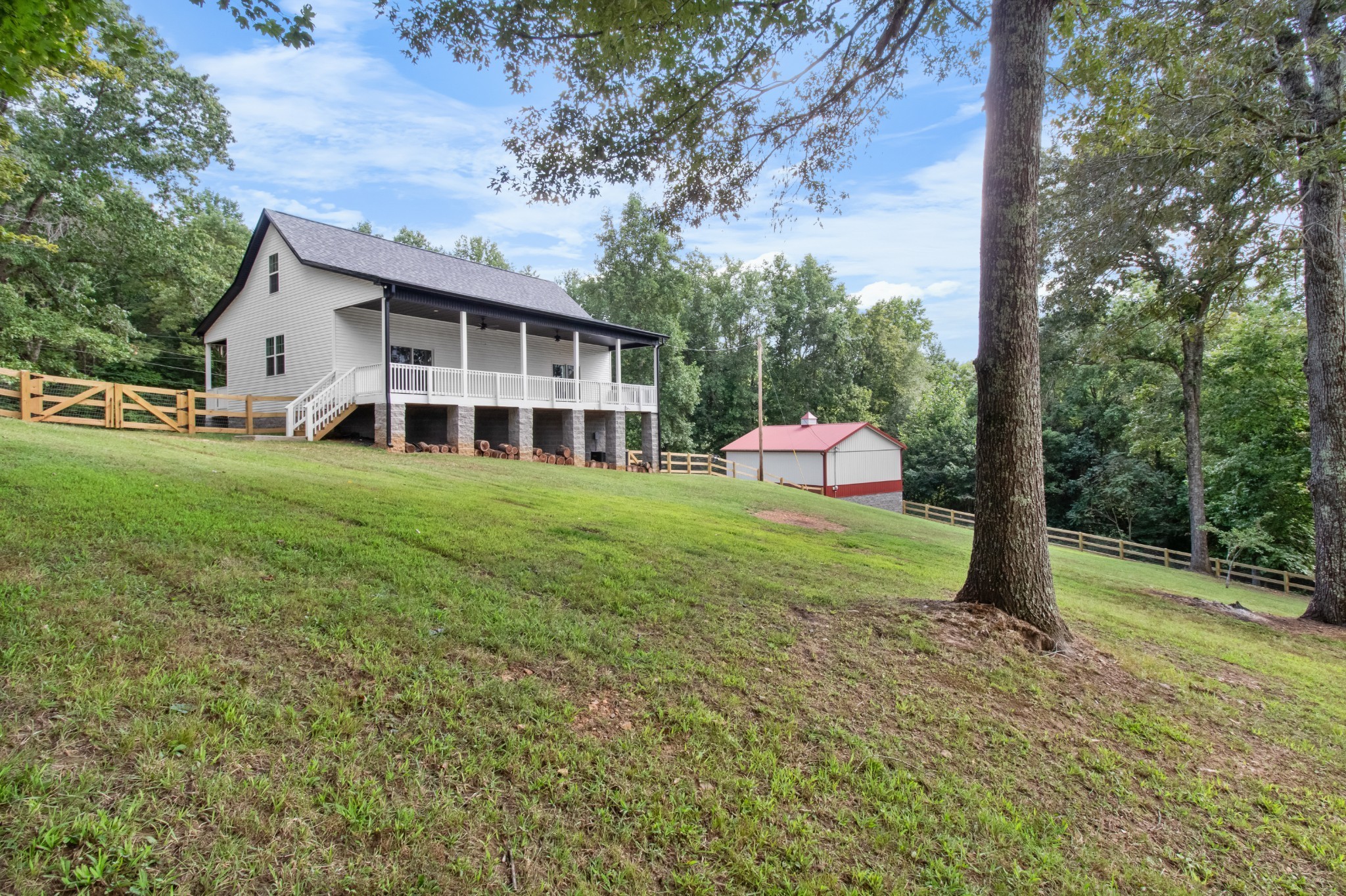 4700 Akin Road Cunningham, TN 37052 - Photo 35 of 36 a view of a house with a yard