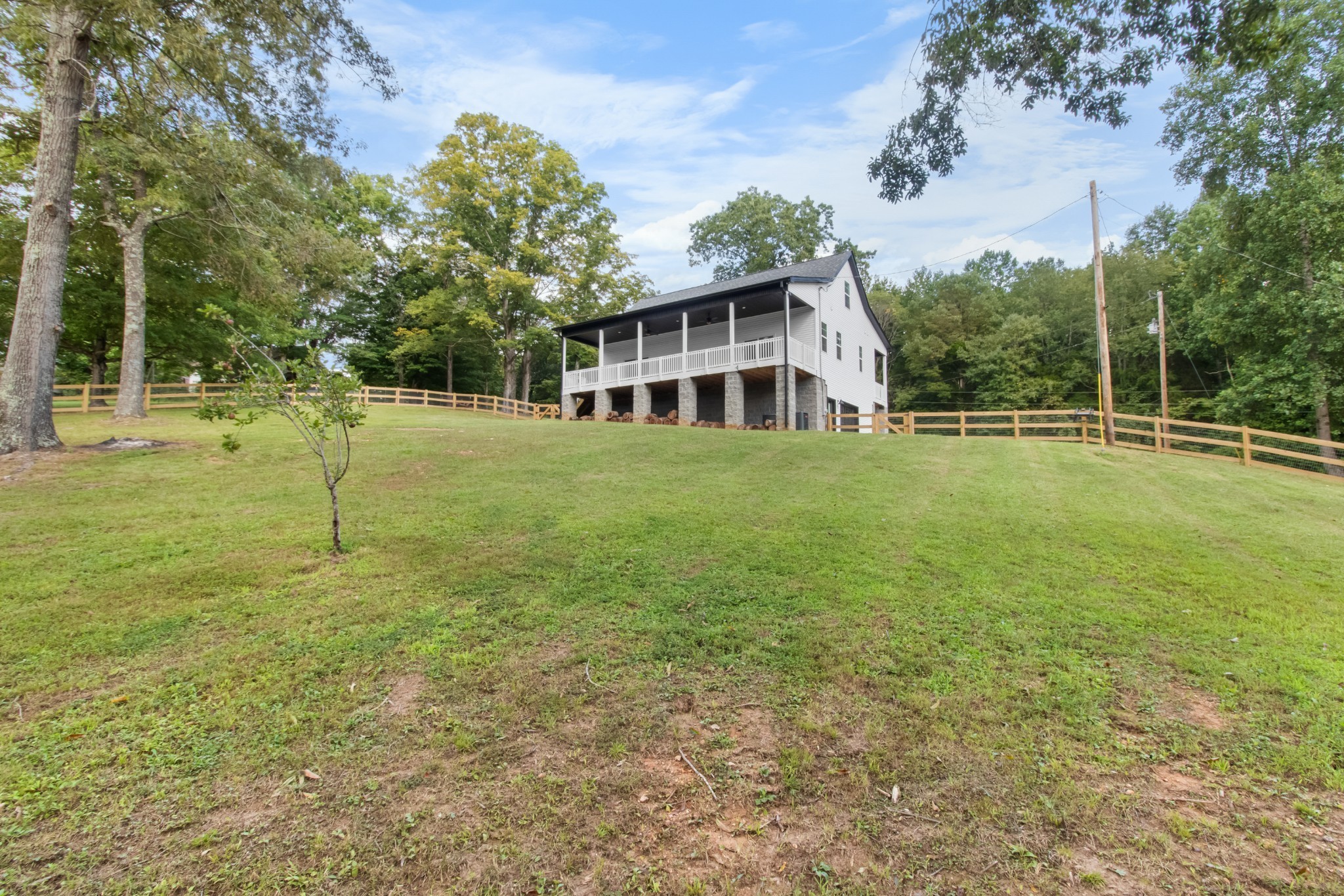 4700 Akin Road Cunningham, TN 37052 - Photo 36 of 36 a view of a house with a yard