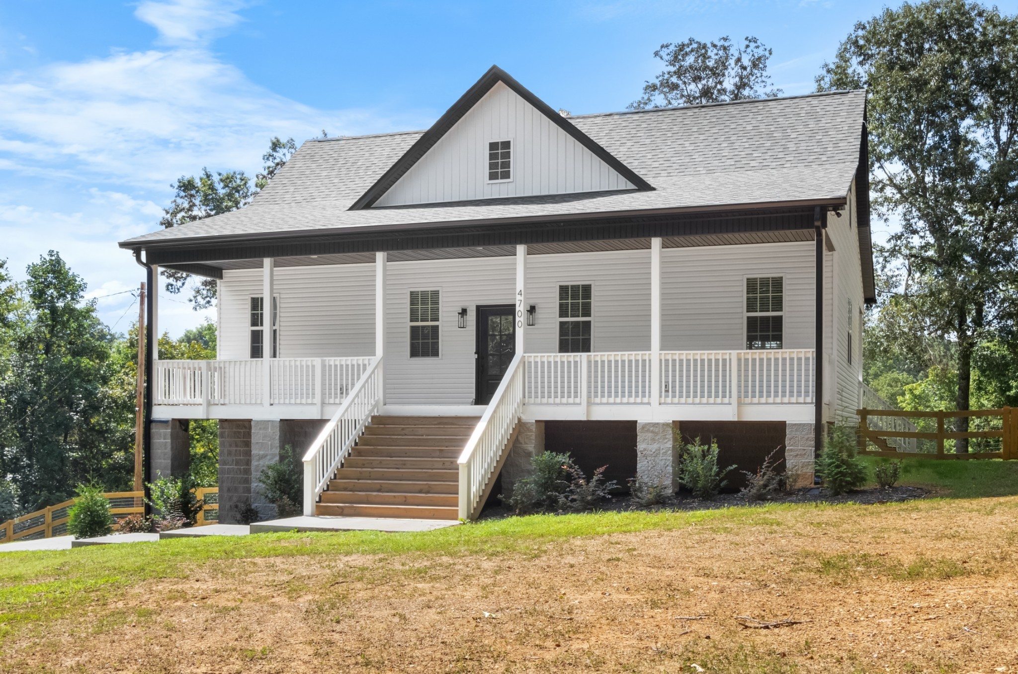 4700 Akin Road Cunningham, TN 37052 - Photo 4 of 36 a front view of a house with a yard