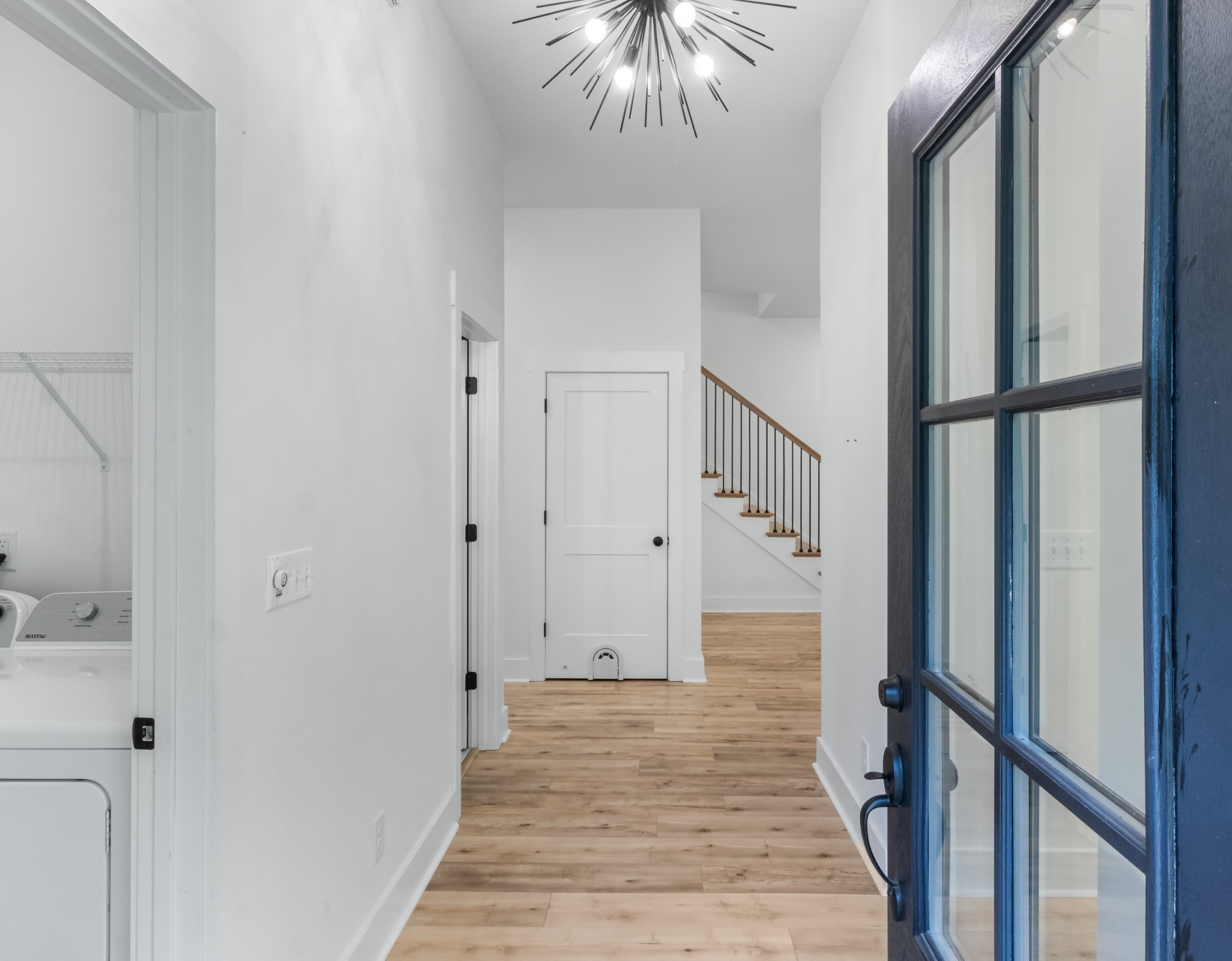 4700 Akin Road Cunningham, TN 37052 - Photo 6 of 36 a view of a hallway with wooden floor and staircase