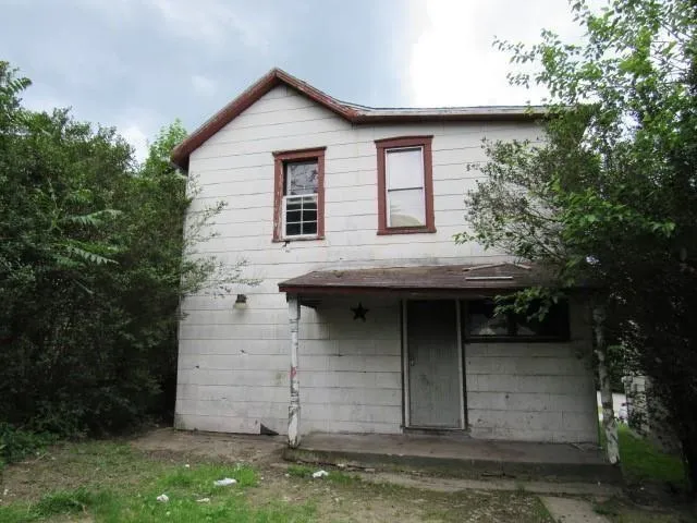 front view of a house with a small yard