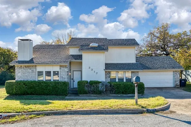 a view of a house with swimming pool and sitting area