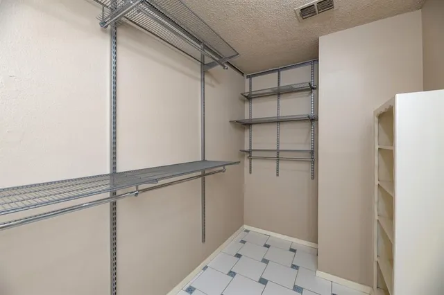 a view of an empty walk in closet