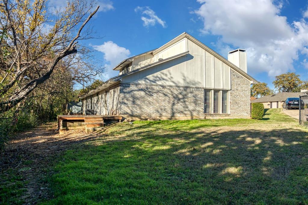 2317 Jenson Circle Fort Worth, TX 76112 - Photo 21 of 21 a view of a house with a yard
