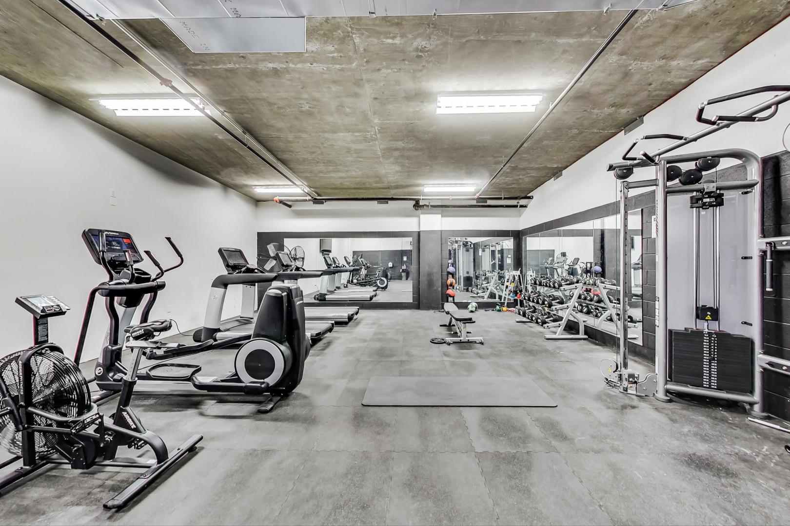 171 North Aberdeen Street, Unit 903 Chicago, IL 60607 - Photo 14 of 15 a view of a room with gym equipment