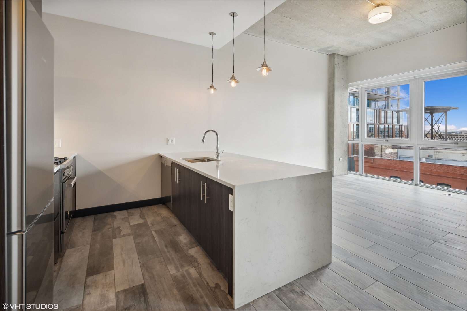 171 North Aberdeen Street, Unit 903 Chicago, IL 60607 - Photo 2 of 15 a kitchen with a sink and cabinets