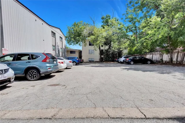 a view of a cars parked in front of a house