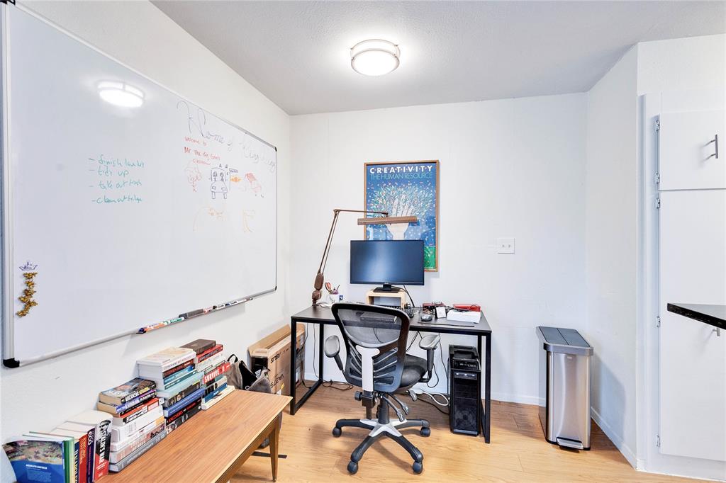 2207 Leon Street, Unit 303 Austin, TX 78705 - Photo 4 of 12 a view of a workspace with furniture and a window