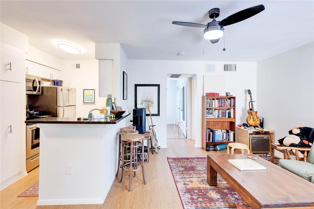 2207 Leon Street, Unit 303 Austin, TX 78705 - Photo 5 of 12 a living room with furniture and a flat screen tv