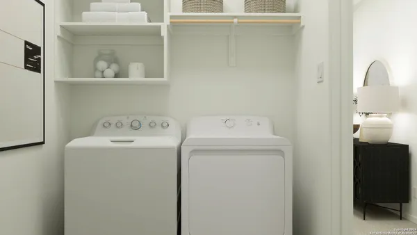 a utility room with dryer and washer