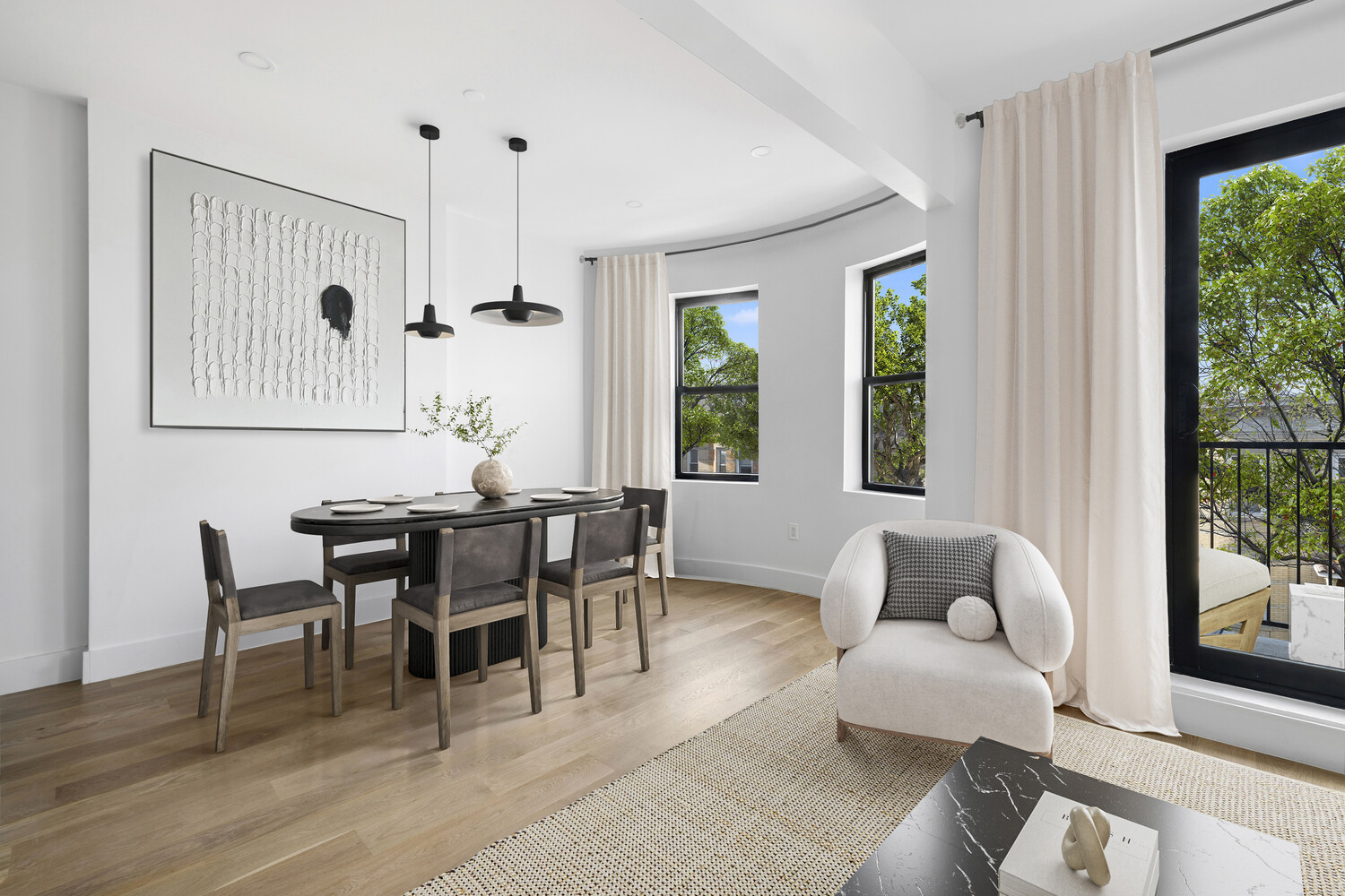 140 Moffat Street, Unit 3 Brooklyn, NY 11207 - Photo 2 of 11 a dining room with furniture a chandelier and wooden floor