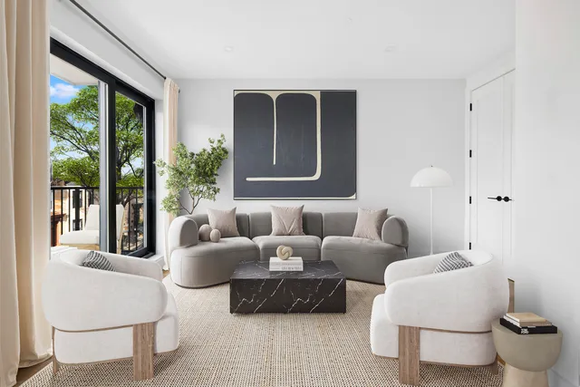 a dining room with furniture a chandelier and wooden floor
