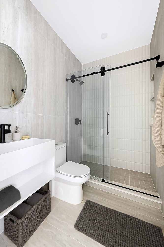 140 Moffat Street, Unit 3 Brooklyn, NY 11207 - Photo 7 of 11 a bathroom with a toilet a sink and a shower