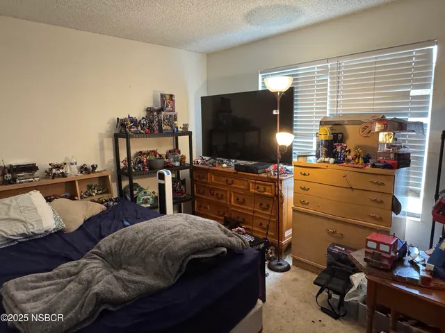a livingroom with furniture and a flat screen tv