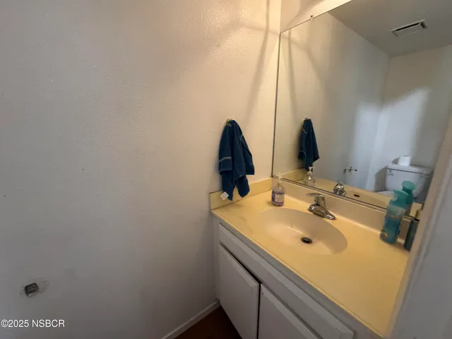 a bathroom with a sink and a window