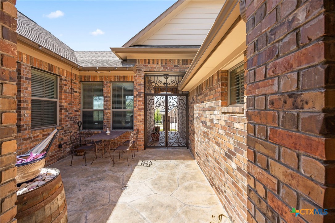 1205 Winding Way Drive Georgetown, TX 78628 - Photo 5 of 39 View from the front door looking towards the custom gate.