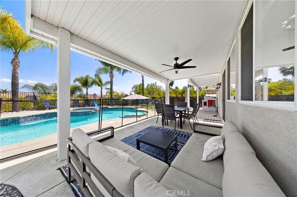 32985 Novara Court Temecula, CA 92592 - Photo 11 of 56 Covered Backyard Patio With Pool Views And Multiple Outdoor Seating Areas