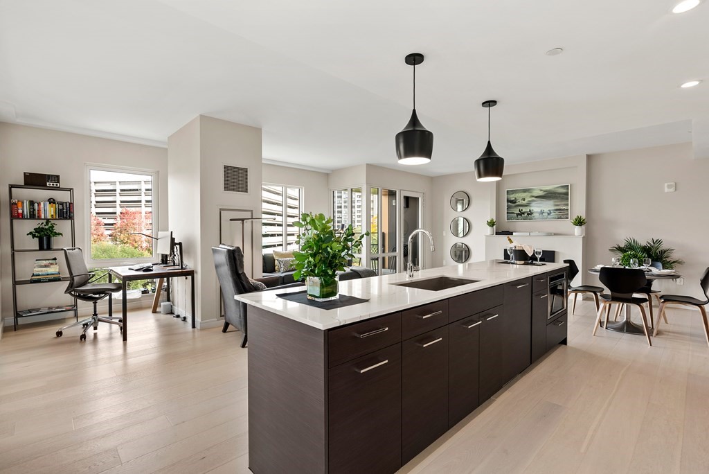 110 Broad Street, Unit 401 Boston, MA 02110 - Photo 4 of 24 a kitchen with sink cabinets and wooden floor