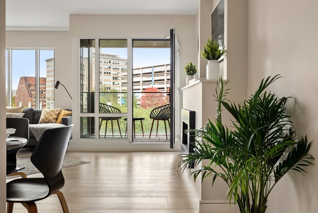 110 Broad Street, Unit 401 Boston, MA 02110 - Photo 10 of 24 a view of a livingroom with furniture and a potted plant