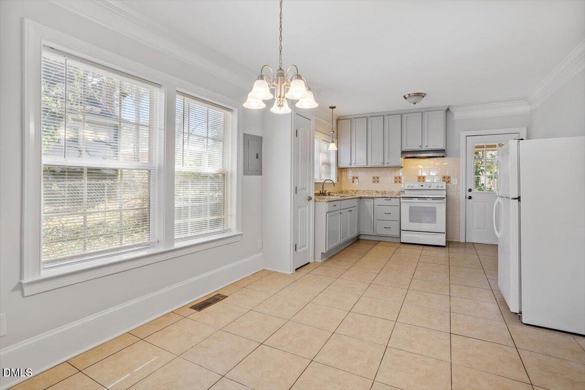 2618 Sater Street Durham, NC 27703 - Photo 10 of 27 a kitchen with refrigerator and window