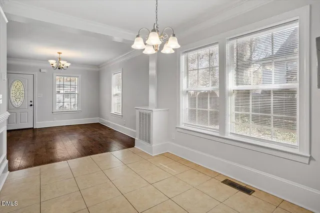 a kitchen with refrigerator and window